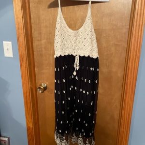 NWT sleeveless black dress with knitting at the top.